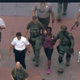 Illustration for article titled A Black Woman in Handcuffs For Climbing The Statue of Liberty on Independence Day is a Perfect Metaphor For America